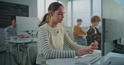 Female Student in University Computer Lab Studies Game Development Stock Footage 318518667