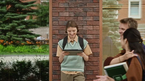 Female Student Using Digital Tablet for Online Learning on Campus Stock Footage 342119640