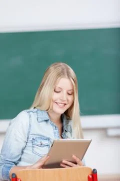 Female student using digital tablet 写真素材