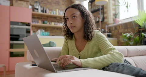 Female Student using a Laptop for Education on Sofa at Home Stock Footage 297266280