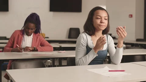 Female Student Using Lip Balm Stock Footage 153210886