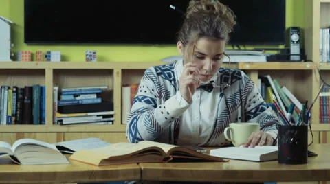 Female student using a tablet to find some information slow motion Stock Footage 59186597