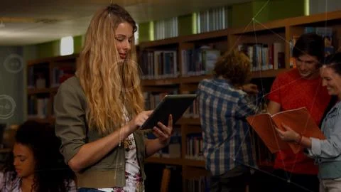 Female student is using tablet in flat design library scene, education with Stock Photos