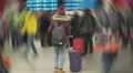 Female student waiting for her airplane, looking on schedule. Creative effect HD Footage