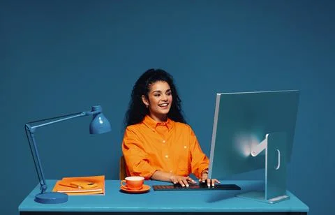 Female student working on a desktop computer with color blocking elements Stock Photos