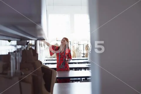 Female student working at a fashion college Stock Photos