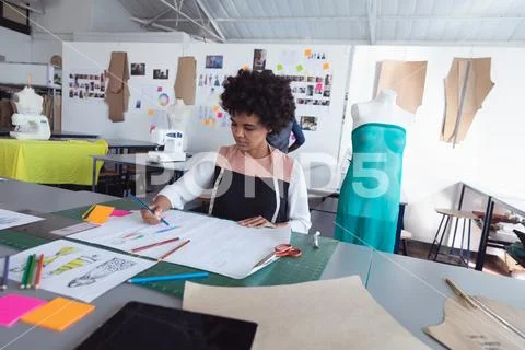 Female student working on a project at a fashion college Stock Photos
