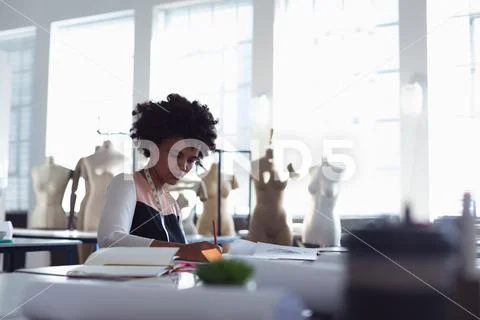 Female student working on a project at a fashion college Stock Photos