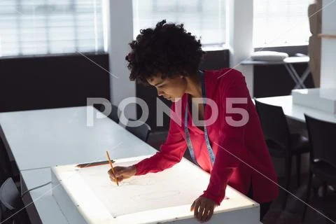 Female student working on a project at a fashion college Stock Photos
