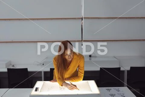 Female student working on a project at a fashion college Stock Photos