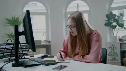 Female Student Write Notes at Modern Desk. Girl Get Tired of Long Learning. Stockbeeldmateriaal 131552858