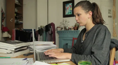 Female student writing on computer Stock Footage 24574059
