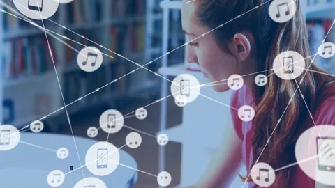 Female student writing notes, tablet icons appearing and expanding into network Video stock 329946532