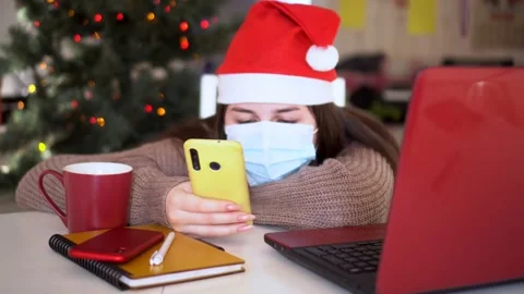 Female studentin santa hat makes conference video call on laptop computer talks Stock Footage 144087375