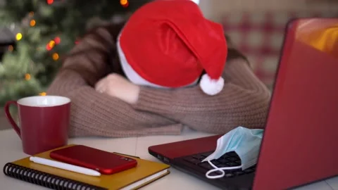 Female studentin santa hat makes conference video call on laptop computer talks Stock Footage 144243581