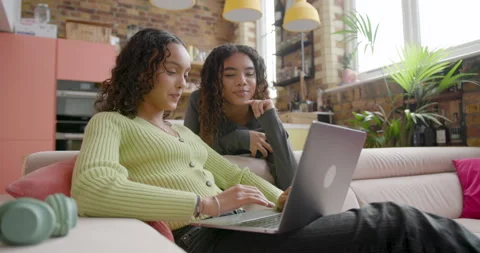 Female Students using Laptop for their College School work at Home Stock Footage 297267131