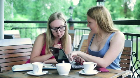 Female students working on laptop computer in cafe Video stock 55869417