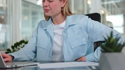 Female suffering from ribs ache while working at office and typing on laptop Stock-Footage 276427557