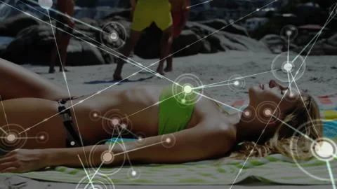 Female sunbather reclining demonstrating technology nodes expanding while man Stock Footage 313703535