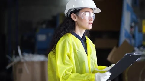 Female supervisor checks documents for waste sorting plant Video stock 243070604