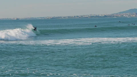 Female surfer falling into the water while catching a big blue wave. Stock Footage 130626946