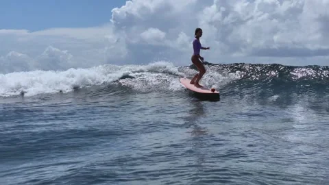 Female Surfer Skillfully Balancing On Small Water Waves Capturing Joy 스톡 동영상 329279139