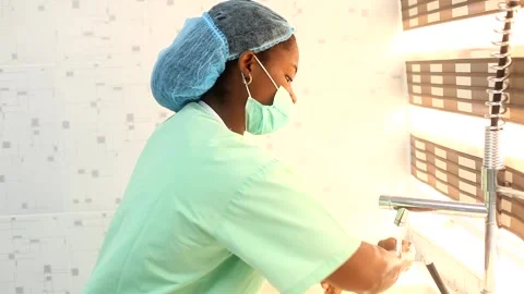 A female surgeon getting ready to operate Stock Footage 271002302