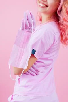 Female surgeon posing while removing face mask Stock-Fotos