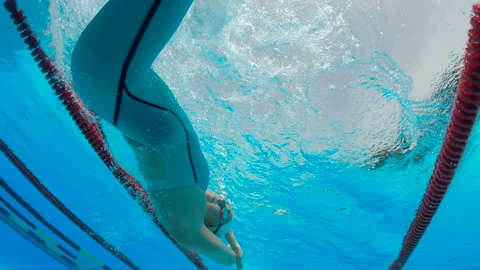 Female swimmer making tumble turn in the... | Stock Video | Pond5