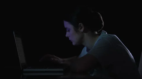 Female system administrator trying to fix errors on laptop, failure, viruses Stock Footage 111885280