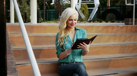 Female on tablet computer Stock Footage 21429174