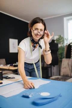 A Female tailor preparing a sewing pattern Stock Photos