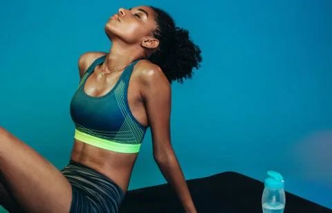 Female taking break from exercise routine Stock Photos
