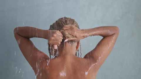 Female taking shower Stock Footage 255446795