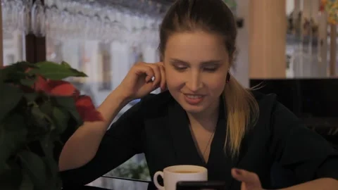 Female talking online, drinking coffee and smiling Stock Footage 133897078