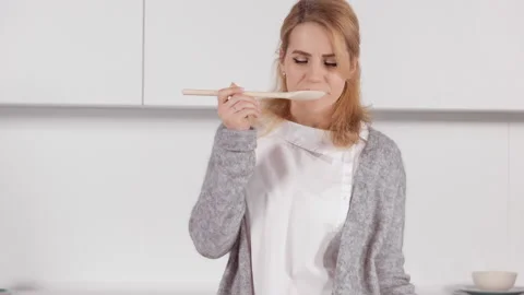 Female tastes soup Stock Footage 155683973