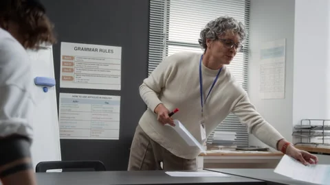 Female Teacher Preparing Class for Prison with Inmates Coming in Stock Footage 328986222
