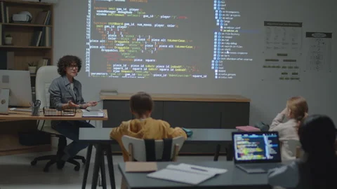 Female Teacher of Programming Explaining Code on Projection Stock Footage 244701170