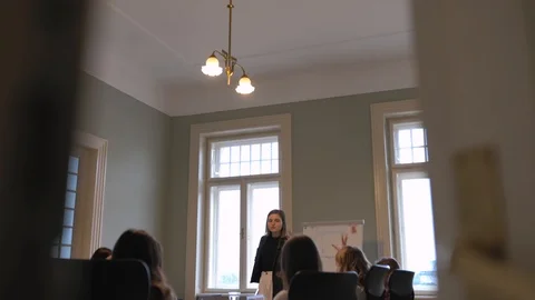 The female team brainstorms at a large table, 4K 動画素材 124716513