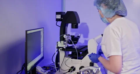 Female team studying DNA mutations. Wearing protective workwear. Female Stock Footage 276429955