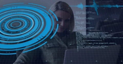Female tech developer typing at laptop reviewing code while blue HUD overlapping Video stock 331270023