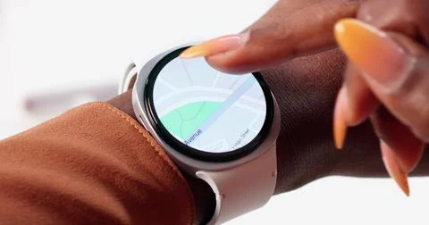 Female Tech Developer Uses Smartwatch GPS To Navigate Fitness Route Stock Photos