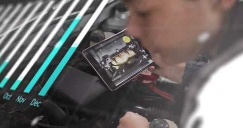 Female tech holding tablet and tapping above auto engine, activating AR overlays Stock Footage 329904549