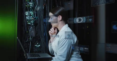 Female tech scanning data center rack reacting to diagnostic HUD, typing on Stock Footage 330330991