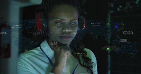 Female tech touching raised hand in data center, showing projected map overlay Stock Footage 333830256