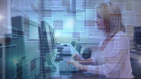 Female tech worker starting typing on keyboard activating binary overlays for Stock Footage 312297718