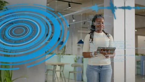 Female tech worker tapping tablet, initiating blue rings and code overlay, Stock Footage 329999930