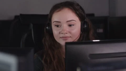 Female Technical Support Specialist Working On Computer In Call Center Office. Stock Footage 194410098