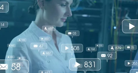 Female technician entering commands in data center, showing animated metrics Stock Footage 329924643
