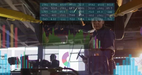 Female technician scanning underside in auto bay, overlaying charts and Stock Footage 329946442